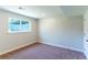 Bedroom featuring neutral paint, carpet flooring, and a large window with views to the backyard at 9410 Perry St, Westminster, CO 80031