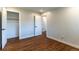 A bedroom with hardwood floors, recessed lighting, and white trim at 9410 Perry St, Westminster, CO 80031
