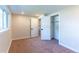 Bedroom boasts natural light, neutral paint, carpet flooring, and a closet at 9410 Perry St, Westminster, CO 80031