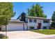 Charming two-story home with a freshly painted white exterior and a neatly maintained front lawn at 9410 Perry St, Westminster, CO 80031