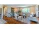 Comfortable living room featuring hardwood floors, a cozy seating area, and stylish decor at 9410 Perry St, Westminster, CO 80031
