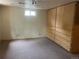 Basement features wall-to-wall cabinetry and storage at 7127 Otis St, Arvada, CO 80003