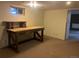 Spacious basement featuring durable work table at 7127 Otis St, Arvada, CO 80003