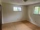 This bedroom features ample natural light from two windows and offers a serene space at 7127 Otis St, Arvada, CO 80003