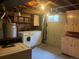 Functional laundry area with washer, dryer, and ample storage cabinets at 7127 Otis St, Arvada, CO 80003