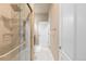 Bathroom featuring a glass-enclosed shower with a rainfall shower head and tile accents at 2669 Red Bird Trl, Castle Rock, CO 80108