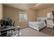 Cozy bedroom provides ample space for computer setup, a comfortable bed, and storage at 2669 Red Bird Trl, Castle Rock, CO 80108