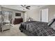 Comfortable bedroom with a ceiling fan, a large dresser and a window for natural light at 2669 Red Bird Trl, Castle Rock, CO 80108