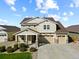 Beautiful two-story home featuring a three-car garage and well-manicured front yard, perfect for suburban living at 2669 Red Bird Trl, Castle Rock, CO 80108