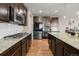 Gourmet kitchen with granite countertops, stainless steel appliances, and plenty of cabinet space at 2669 Red Bird Trl, Castle Rock, CO 80108