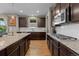 Spacious gourmet kitchen featuring stainless steel appliances, granite countertops, and ample storage at 2669 Red Bird Trl, Castle Rock, CO 80108