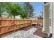 Cozy backyard with privacy fence, stone patio, and mulch area, perfect for outdoor relaxation at 9110 Gale Blvd # 3, Thornton, CO 80260