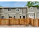 Fenced backyard and back exterior of home, offering a private outdoor space for entertaining and relaxation at 9110 Gale Blvd # 3, Thornton, CO 80260