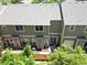 Overhead view of a condo backyard with small patio, partial fence, and mature trees offering nice privacy at 9110 Gale Blvd # 3, Thornton, CO 80260