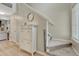 Inviting hallway featuring wood floors, leading to a carpeted staircase at 9110 Gale Blvd # 3, Thornton, CO 80260
