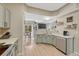 Bright, open-concept kitchen showcasing views into the dining and living rooms at 9110 Gale Blvd # 3, Thornton, CO 80260