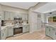 Modern kitchen featuring light-colored cabinets, stainless steel appliances, and sleek countertops at 9110 Gale Blvd # 3, Thornton, CO 80260