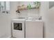 Functional laundry room with modern appliances and ample storage shelving at 9110 Gale Blvd # 3, Thornton, CO 80260