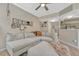 Open-concept living room featuring a large sectional sofa and stylish decor at 9110 Gale Blvd # 3, Thornton, CO 80260