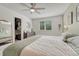 Bedroom featuring an organized closet, dresser, and natural light at 9110 Gale Blvd # 3, Thornton, CO 80260