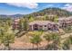Stunning aerial view of a home nestled in a lush, tree-filled neighborhood on a hill at 1007 Nob Hill Rd, Evergreen, CO 80439