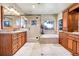 Elegant bathroom with custom cabinets, granite counters, a glass shower, and soaking tub at 1007 Nob Hill Rd, Evergreen, CO 80439