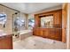 Luxurious bathroom featuring a soaking tub with a view, and granite counters at 1007 Nob Hill Rd, Evergreen, CO 80439