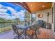 Outdoor deck with dining furniture, mountain views, outdoor grill, and space for entertaining at 1007 Nob Hill Rd, Evergreen, CO 80439