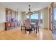 Bright dining room featuring mountain views, hardwood floors, modern lighting, and stylish decor at 1007 Nob Hill Rd, Evergreen, CO 80439