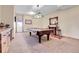 Relaxing recreation room features a pool table, bar with stools, and outdoor access at 1007 Nob Hill Rd, Evergreen, CO 80439