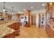 Large gourmet kitchen with wood floors, granite counters, stainless appliances, and abundant cabinet space at 1007 Nob Hill Rd, Evergreen, CO 80439