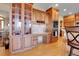 Kitchen with custom cabinets, granite countertops, built-in appliances, and breakfast bar at 1007 Nob Hill Rd, Evergreen, CO 80439
