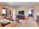 Cozy living room with comfortable seating and a large television for relaxation and entertainment at 1007 Nob Hill Rd, Evergreen, CO 80439