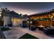 Cozy backyard features a hot tub, patio, pergola with string lights, and outdoor seating area at 340 S Logan St, Denver, CO 80209