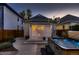 Backyard view featuring a patio, hot tub, and access to the house through a back door at 340 S Logan St, Denver, CO 80209
