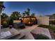 Inviting backyard with a hot tub, pergola with lights, and a seating area around a fire pit at 340 S Logan St, Denver, CO 80209