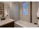 Bright bathroom featuring a bathtub and modern fixtures at 340 S Logan St, Denver, CO 80209