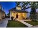 Inviting home showcasing a quaint front porch, lush green lawn, and classic design elements, ideal for a cozy atmosphere at 340 S Logan St, Denver, CO 80209