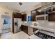 Modern kitchen featuring stainless steel appliances and sleek, dark cabinetry at 340 S Logan St, Denver, CO 80209