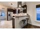 Modern kitchen featuring sleek stainless steel appliances, stylish bar seating, and ample counter space, ideal for cooking at 340 S Logan St, Denver, CO 80209