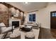 Bright living room with a charming fireplace, large window, and contemporary decor, creating a warm and inviting space at 340 S Logan St, Denver, CO 80209