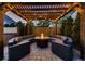 Backyard pergola with seating and fire pit, creating an inviting outdoor gathering space at 340 S Logan St, Denver, CO 80209