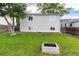 Inviting backyard featuring a well-maintained lawn, mature trees, and the home's exterior at 4800 S Tabor St, Morrison, CO 80465