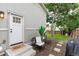 Charming backyard entrance with outdoor seating, lush greenery, and a well-maintained landscape at 4800 S Tabor St, Morrison, CO 80465