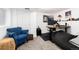Cozy basement featuring a desk area, comfortable seating, and ample space for relaxation and work at 4800 S Tabor St, Morrison, CO 80465