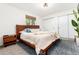 Cozy bedroom features a wooden bed frame, plush bedding, and a modern minimalist style at 4800 S Tabor St, Morrison, CO 80465