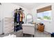 Bright bedroom featuring a closet with ample storage and a cozy sitting area with a window view at 4800 S Tabor St, Morrison, CO 80465