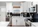 Well-equipped kitchen features stainless steel appliances and white cabinets at 4800 S Tabor St, Morrison, CO 80465
