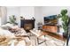 Bright living room features a stylish fireplace, wood floors, and decor at 4800 S Tabor St, Morrison, CO 80465