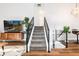 Modern staircase design featuring black railings and natural wood accents at 4800 S Tabor St, Morrison, CO 80465